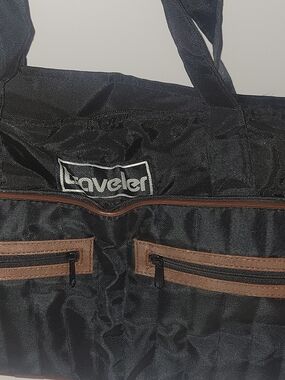 Traveler Foldable Black Duffel Bag with Brown Trim and Front Zip Pockets